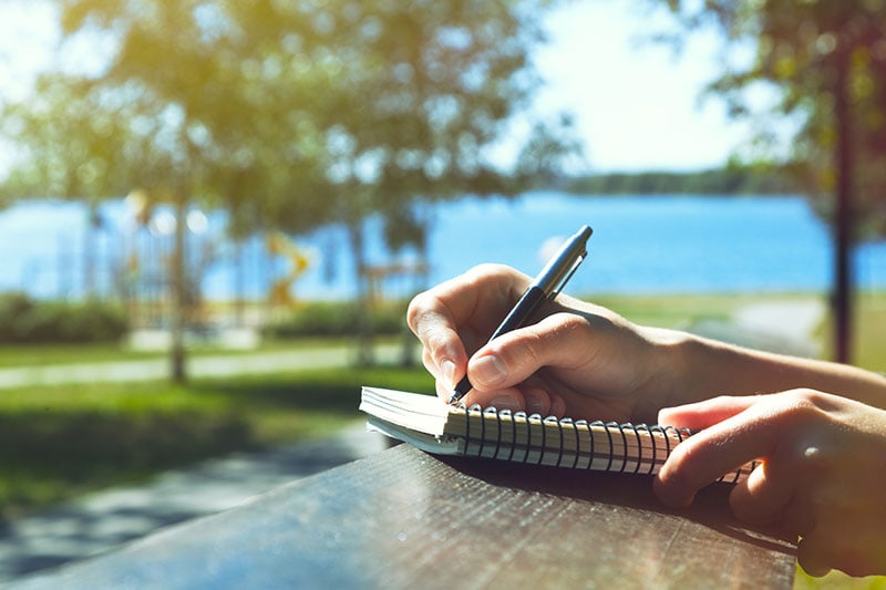 writing outside on picnic table